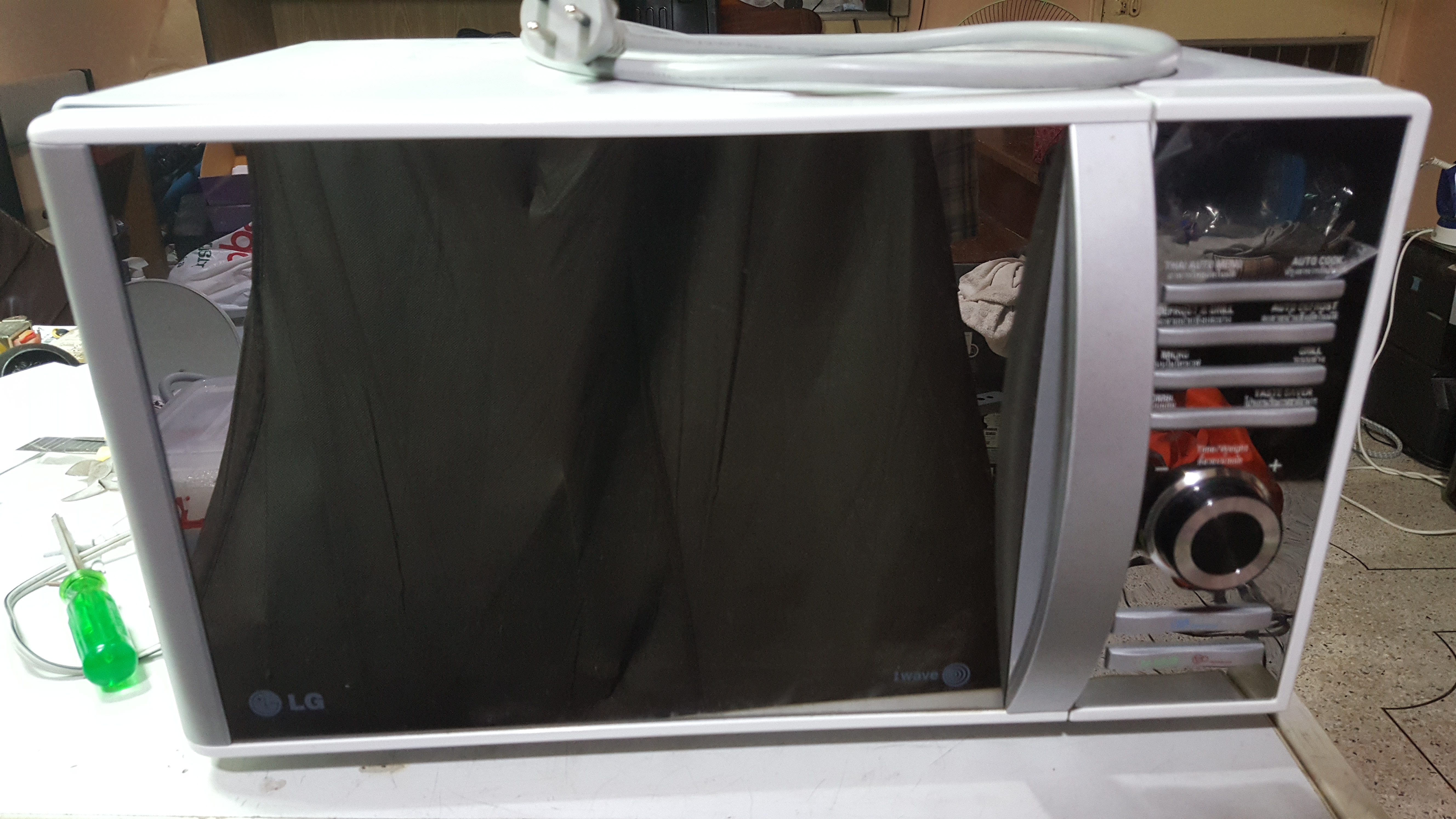 ซ่อมเตาอบไมโครเวฟ ยี่ห้อ LG รุ่น MH638BAR อาการปุ่มหมุนตั้งเวลาไม่ได้