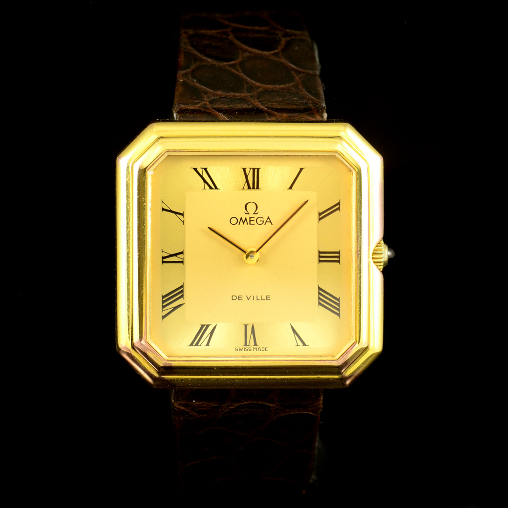 Omega De ville หน้าปัดสีทอง หลักเลขโรมัน ตัวเรือนสี่เหลียม Asscher Silverหุ้มทอง สายหนังและหัวเข็มขัดแท้ ปี1973 ไขลาน 32 x 32 mm