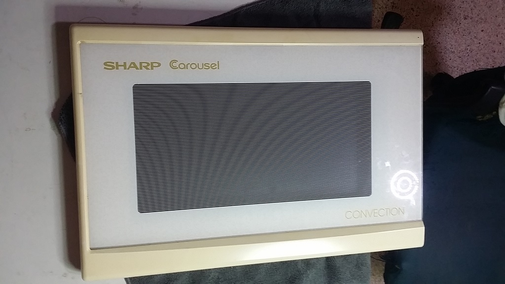 ซ่อมไมโครเวฟ ยี่ห้อ SHARP รุ่น R-7A56 อาการขาล๊อกประตูหัก